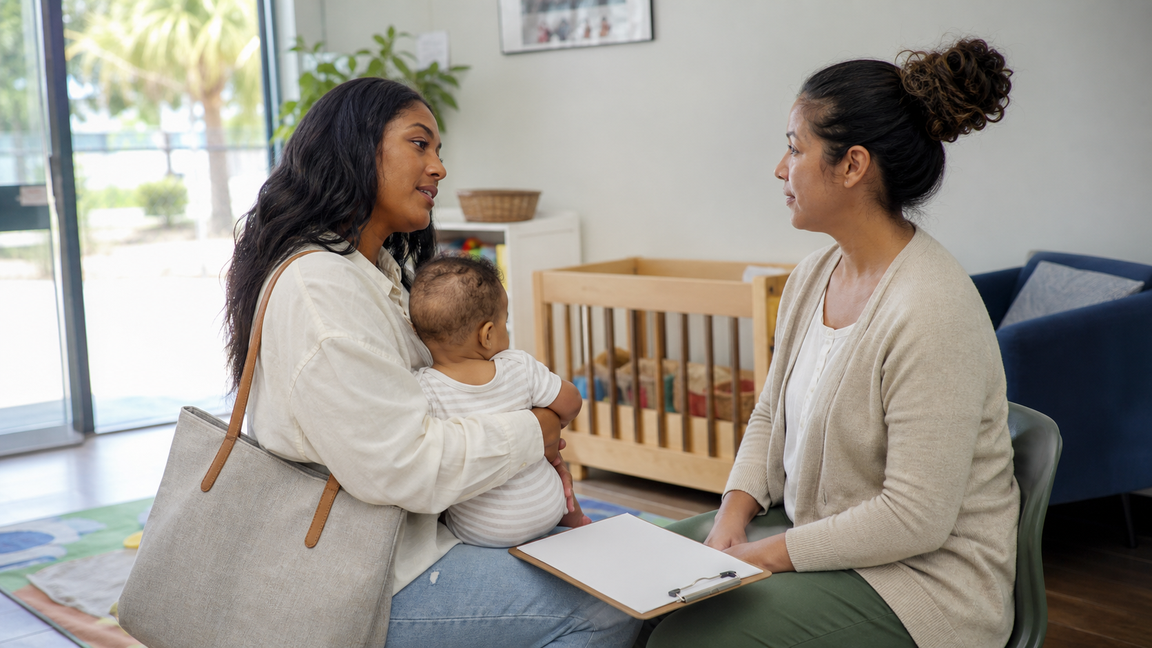 Parent speaking with an infant caregiver at pickup